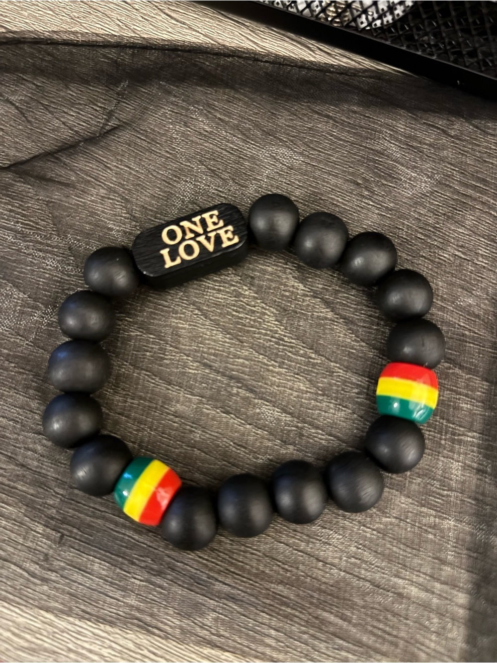 Handmade One Love Matte Black Bead Bracelet with Rasta Accents